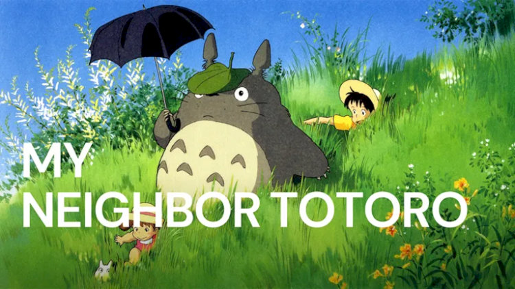 Totoro che chiếc ô khổng lồ cho hai chị em dưới cơn mưa, nụ cười hiền lành giữa tiếng lá xào xạc.